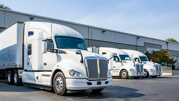 Electric semi trucks at loading bays